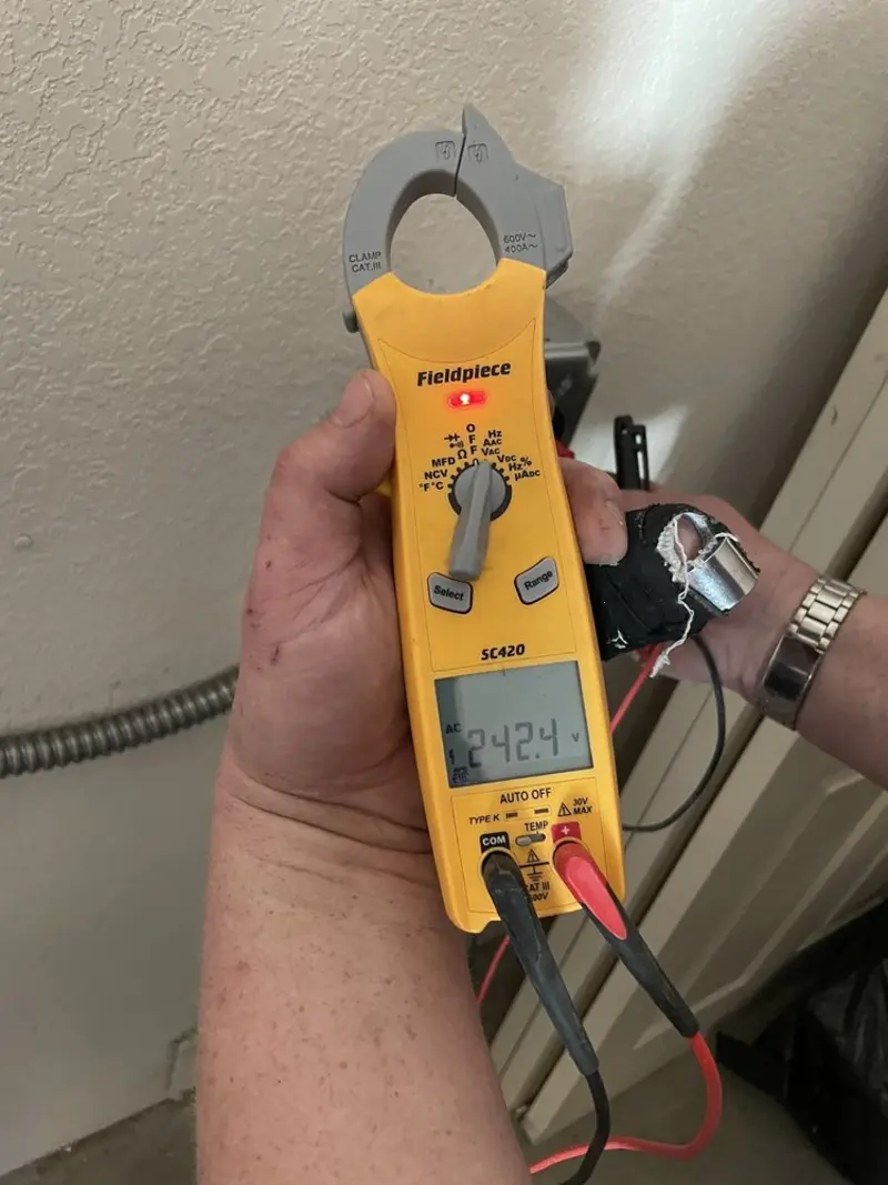 Voltage testing with clamp meter during Aluminum Wiring Replacement in Iosco